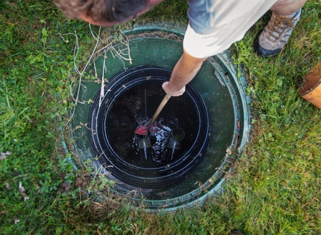 Person scooping stuff up from a big drain Middleburg fl