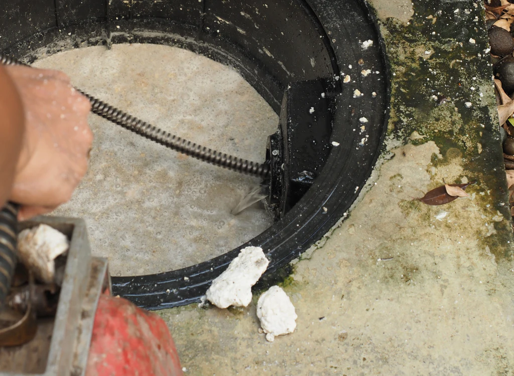 plumber repairing clogged grease trap middleburg fl